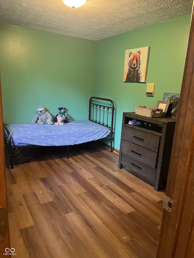 10308 Stormhaven Way, Indianapolis, IN 46256 - bedroom with wood finished floors and a textured ceiling