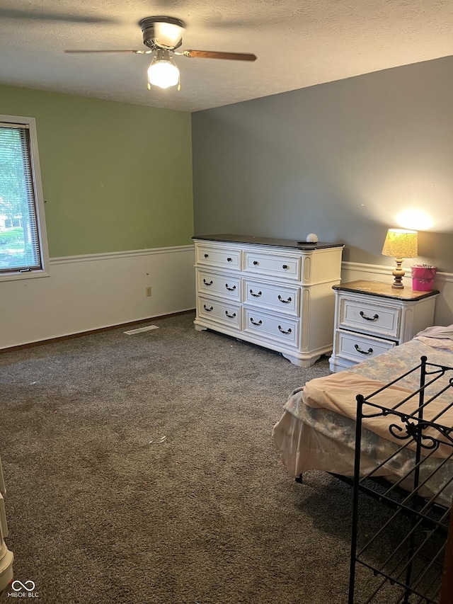 10308 Stormhaven Way, Indianapolis, IN 46256 - bedroom featuring dark colored carpet, a ceiling fan, and a textured ceiling