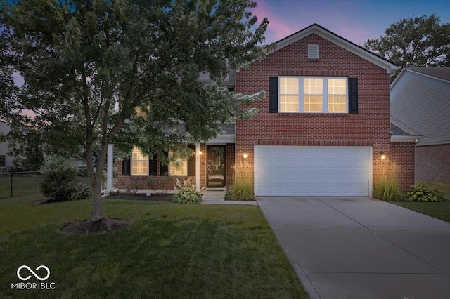 13386 Smokey Quartz Ln, Fishers, IN 46038 - view of front of property with brick siding, driveway, a yard, and an attached garage