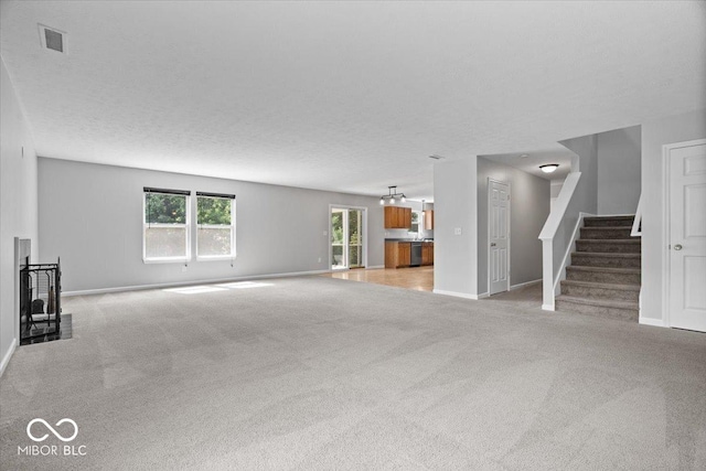 13386 Smokey Quartz Ln, Fishers, IN 46038 - unfurnished living room with light carpet and stairs