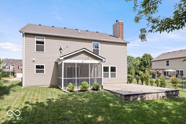 13386 Smokey Quartz Ln, Fishers, IN 46038 - back of property with a patio area, a sunroom, a lawn, and a chimney