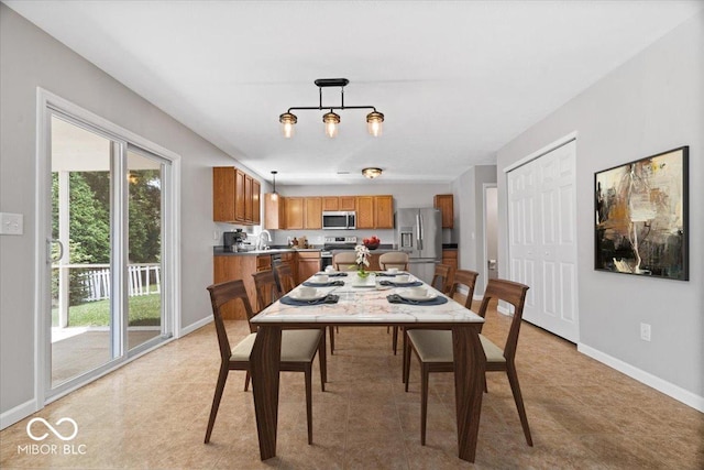 13386 Smokey Quartz Ln, Fishers, IN 46038 - dining room with baseboards and light tile patterned floors