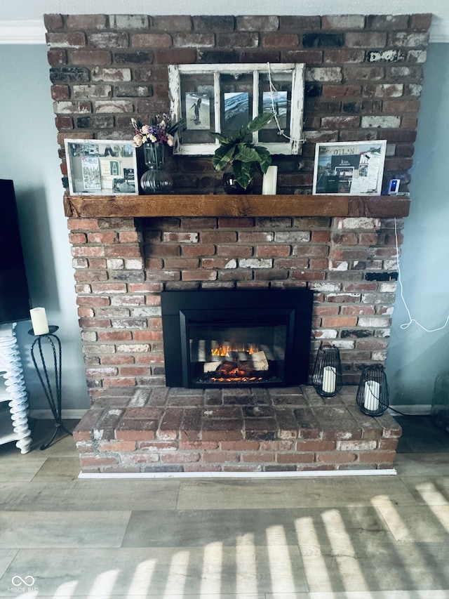 5818 N Fortville Pike, Greenfield, IN 46140 - detailed view of a fireplace, wood finished floors, and crown molding