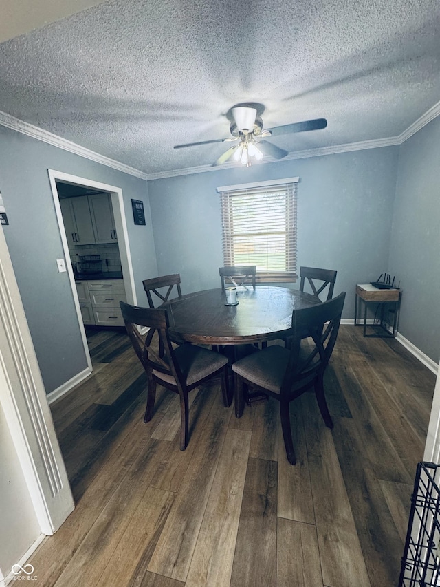 5818 N Fortville Pike, Greenfield, IN 46140 - dining space with wood finished floors, a textured ceiling, ornamental molding, and a ceiling fan