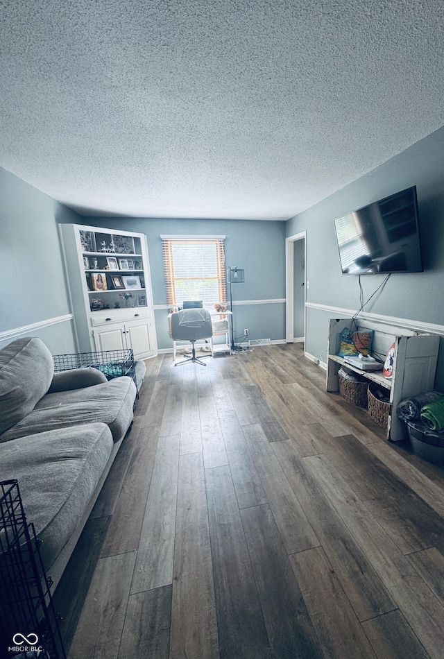 5818 N Fortville Pike, Greenfield, IN 46140 - living area featuring a textured ceiling and hardwood / wood-style flooring