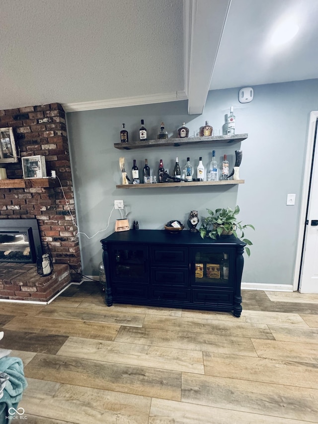 5818 N Fortville Pike, Greenfield, IN 46140 - indoor dry bar featuring light wood-type flooring and a textured ceiling