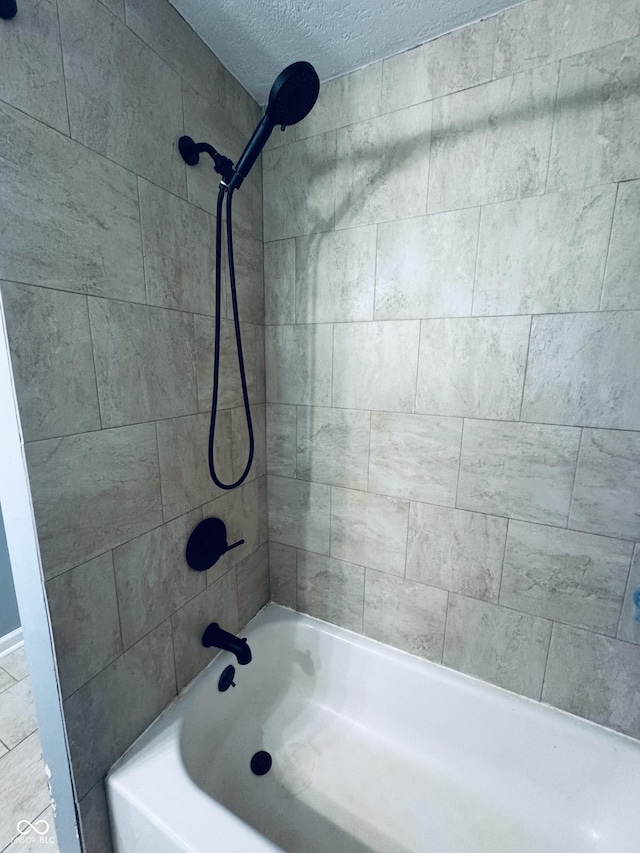 5818 N Fortville Pike, Greenfield, IN 46140 - bathroom featuring shower / washtub combination and a textured ceiling