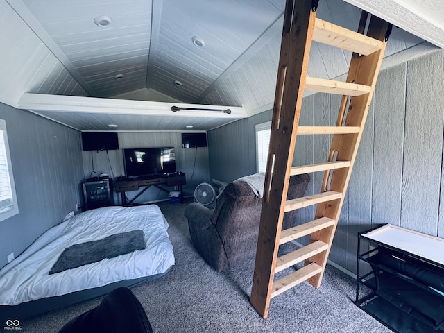 5818 N Fortville Pike, Greenfield, IN 46140 - carpeted bedroom with multiple windows, vaulted ceiling, and wooden walls