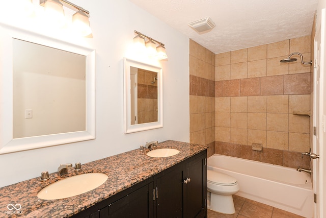 7547 Prairie Lake Dr, Indianapolis, IN 46256 - full bath featuring double vanity, shower / bathtub combination, tile patterned flooring, and a textured ceiling