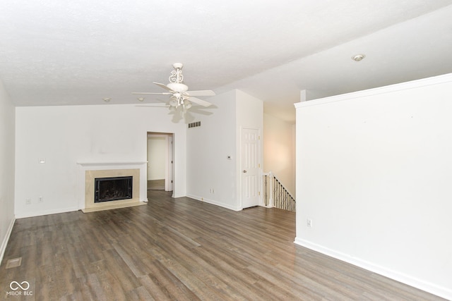 7547 Prairie Lake Dr, Indianapolis, IN 46256 - unfurnished living room with wood finished floors, lofted ceiling, a ceiling fan, and a fireplace with flush hearth
