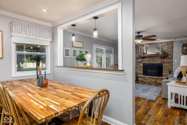 2748 S Meridian Rd, Greenfield, IN 46140 - dining room featuring hardwood / wood-style flooring, ceiling fan, crown molding, a stone fireplace, and french doors