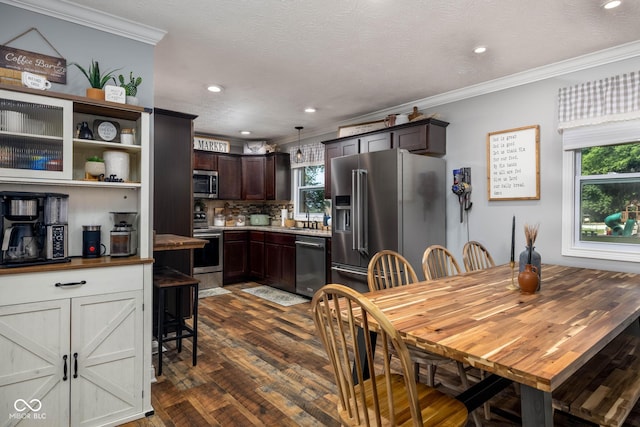 2748 S Meridian Rd, Greenfield, IN 46140 - dining area featuring healthy amount of natural light, dark wood finished floors, crown molding, and recessed lighting