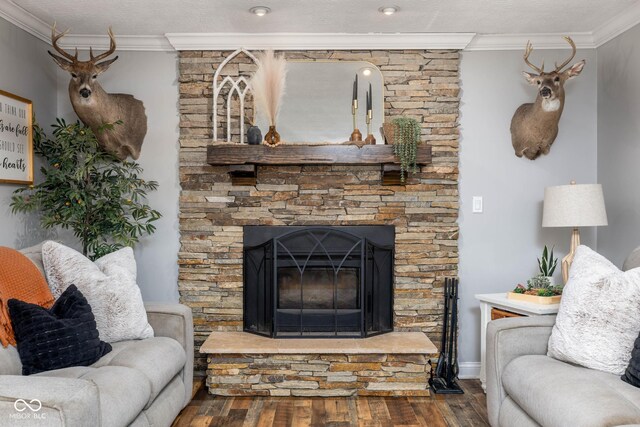 2748 S Meridian Rd, Greenfield, IN 46140 - living room featuring crown molding, wood finished floors, and a stone fireplace