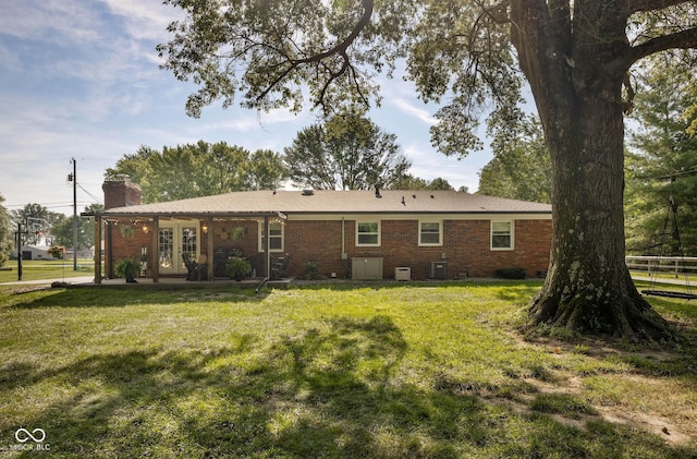 2748 S Meridian Rd, Greenfield, IN 46140 - back of house with french doors, a chimney, and brick siding