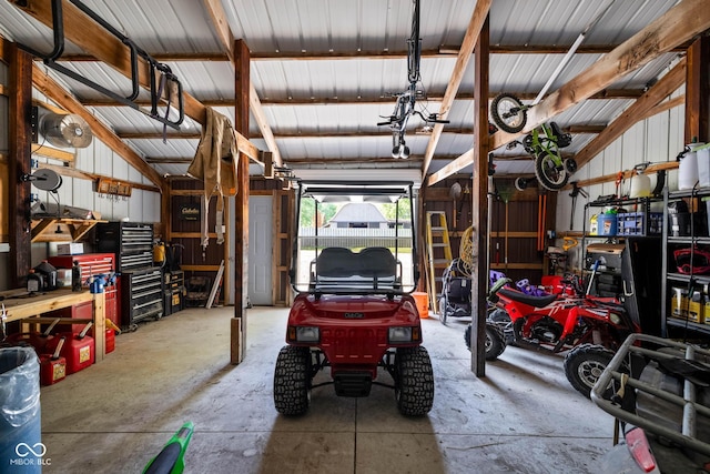 2748 S Meridian Rd, Greenfield, IN 46140 - garage with a workshop area and metal wall