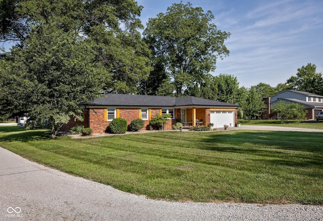 2748 S Meridian Rd, Greenfield, IN 46140 - ranch-style house featuring an attached garage, concrete driveway, a front yard, and brick siding