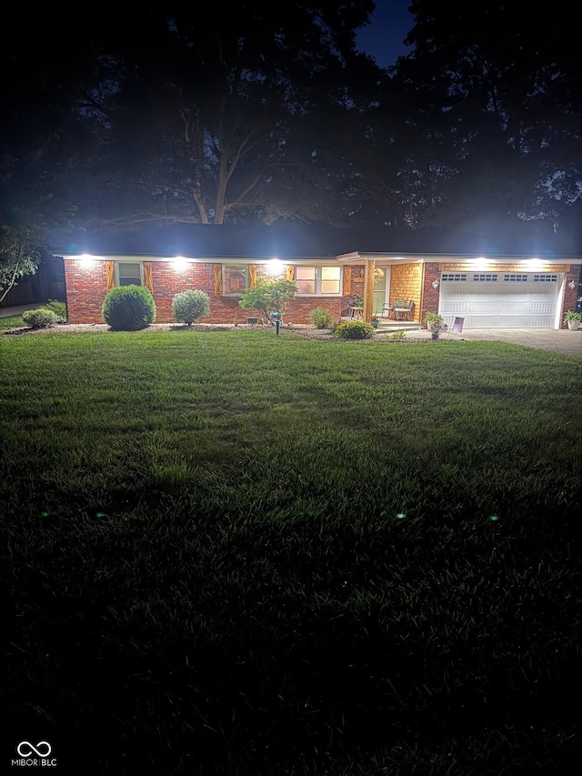 2748 S Meridian Rd, Greenfield, IN 46140 - ranch-style home with a lawn and brick siding