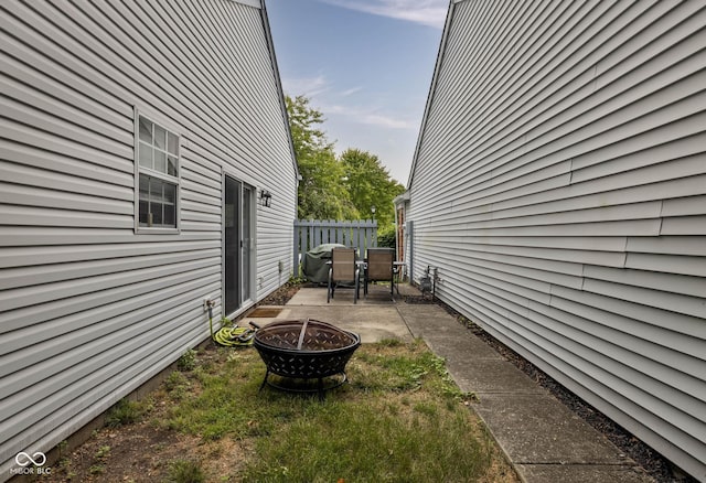 9751 Roxbury Dr, Fishers, IN 46038 - view of property exterior with an outdoor fire pit and a patio