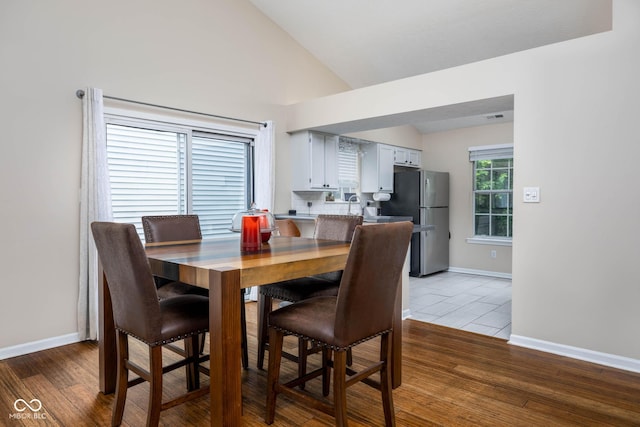 9751 Roxbury Dr, Fishers, IN 46038 - dining room with vaulted ceiling and light wood-type flooring