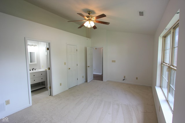 12221 Tallowtree Ct, Indianapolis, IN 46236 - unfurnished bedroom with light colored carpet, lofted ceiling, connected bathroom, and a ceiling fan