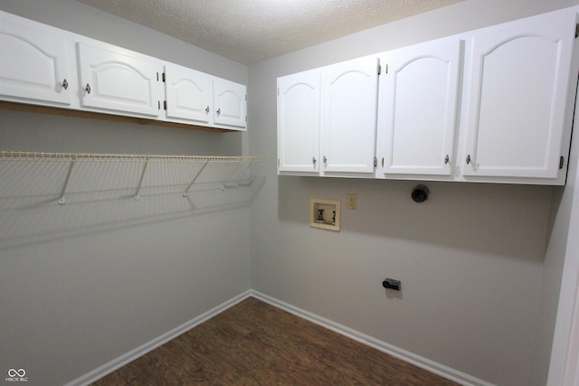 12221 Tallowtree Ct, Indianapolis, IN 46236 - washroom with cabinet space, dark wood-style flooring, hookup for a washing machine, and a textured ceiling