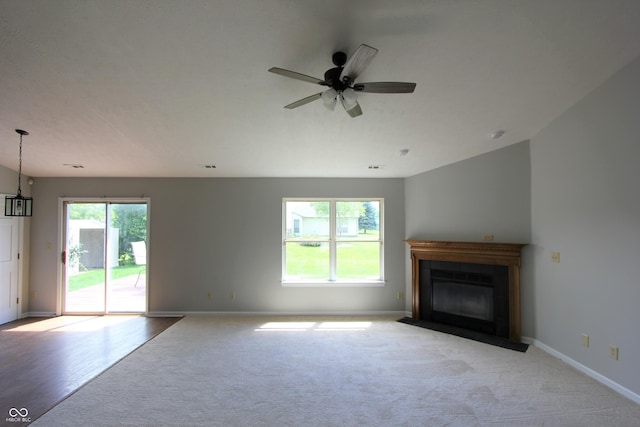 12221 Tallowtree Ct, Indianapolis, IN 46236 - unfurnished living room with carpet floors, a ceiling fan, and a fireplace with flush hearth