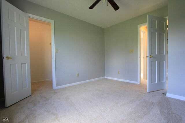 12221 Tallowtree Ct, Indianapolis, IN 46236 - unfurnished bedroom featuring carpet flooring and a ceiling fan