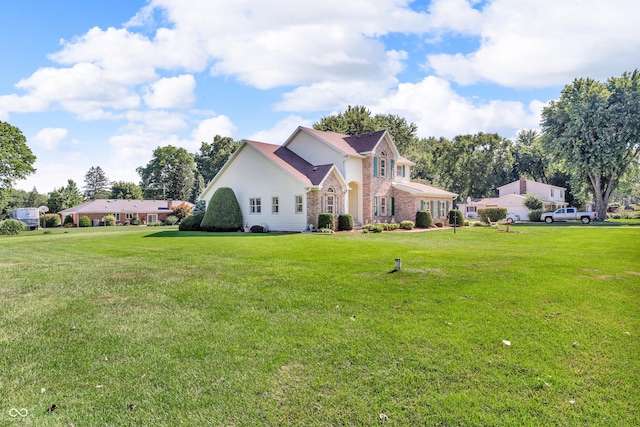 3244 W Burning Tree Rd, Crawfordsville, IN 47933 - traditional home with a front yard and stone siding