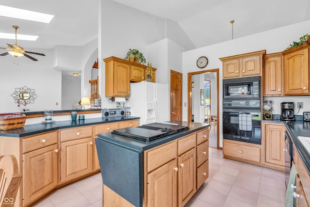 3244 W Burning Tree Rd, Crawfordsville, IN 47933 - kitchen featuring black appliances, dark countertops, ceiling fan, a skylight, and a kitchen island