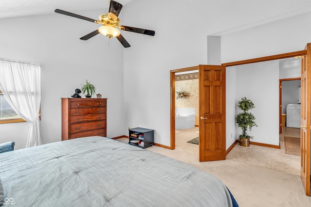 3244 W Burning Tree Rd, Crawfordsville, IN 47933 - bedroom with washer / clothes dryer, light carpet, high vaulted ceiling, a ceiling fan, and ensuite bathroom
