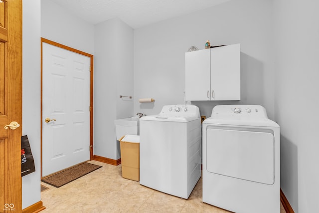 3244 W Burning Tree Rd, Crawfordsville, IN 47933 - laundry room with cabinet space and separate washer and dryer