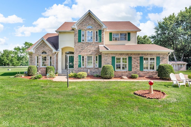 3244 W Burning Tree Rd, Crawfordsville, IN 47933 - view of front of home featuring brick siding, a front yard, and roof with shingles