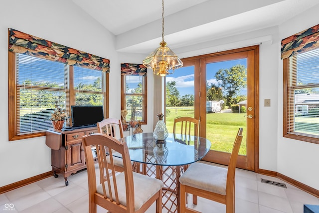 3244 W Burning Tree Rd, Crawfordsville, IN 47933 - dining space with a chandelier, lofted ceiling, and light tile patterned floors