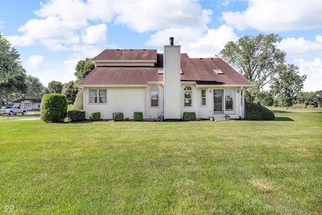 3244 W Burning Tree Rd, Crawfordsville, IN 47933 - rear view of property with a chimney, a lawn, and roof with shingles