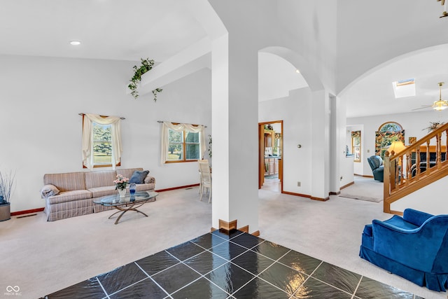 3244 W Burning Tree Rd, Crawfordsville, IN 47933 - living area with carpet flooring, arched walkways, a towering ceiling, recessed lighting, and ceiling fan