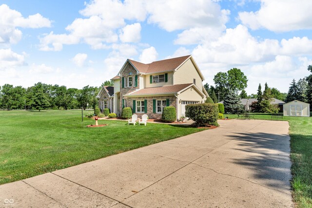 3244 W Burning Tree Rd, Crawfordsville, IN 47933 - traditional-style home featuring a shed, concrete driveway, brick siding, an attached garage, and a shingled roof