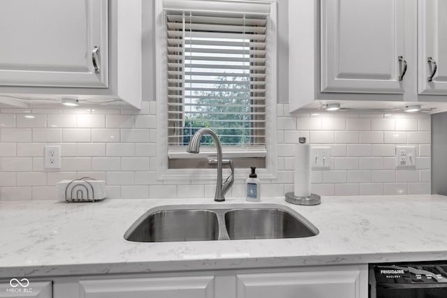 1006 Barry Dr, Lebanon, IN 46052 - kitchen with dishwasher, tasteful backsplash, white cabinets, and light stone countertops