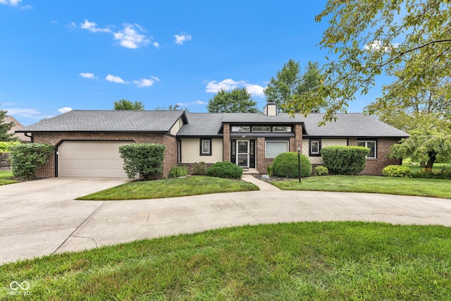 1006 Barry Dr, Lebanon, IN 46052 - view of front of house with driveway, brick siding, and a front yard