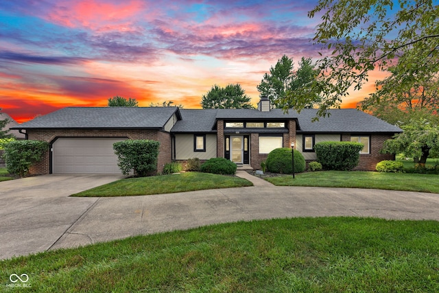 1006 Barry Dr, Lebanon, IN 46052 - view of front of property featuring driveway, brick siding, and an attached garage