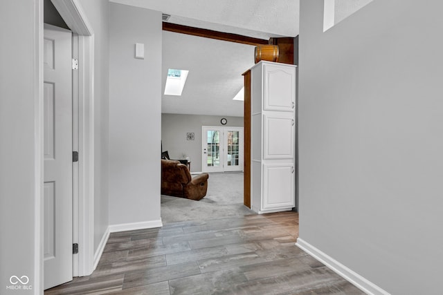 1006 Barry Dr, Lebanon, IN 46052 - hall featuring a skylight and wood finished floors