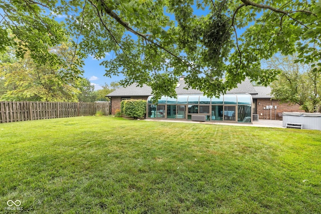 1006 Barry Dr, Lebanon, IN 46052 - view of yard featuring a sunroom and a hot tub