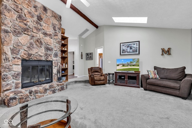 1006 Barry Dr, Lebanon, IN 46052 - living room featuring carpet floors, a skylight, a stone fireplace, beamed ceiling, and high vaulted ceiling
