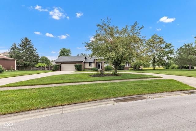 1006 Barry Dr, Lebanon, IN 46052 - view of front facade featuring driveway, an attached garage, and a front yard
