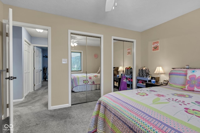 1006 Barry Dr, Lebanon, IN 46052 - carpeted bedroom featuring multiple closets and ceiling fan