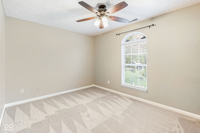 14098 Mimosa Ct, Fishers, IN 46038 - spare room featuring plenty of natural light, light carpet, a textured ceiling, and ceiling fan