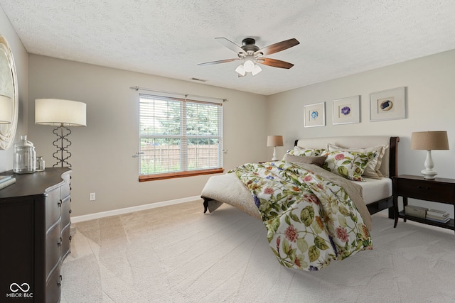 14098 Mimosa Ct, Fishers, IN 46038 - bedroom with light carpet, a textured ceiling, and ceiling fan