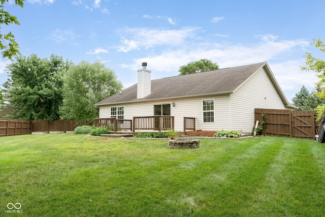 14098 Mimosa Ct, Fishers, IN 46038 - rear view of house with a fenced backyard, a wooden deck, a chimney, and an outdoor fire pit
