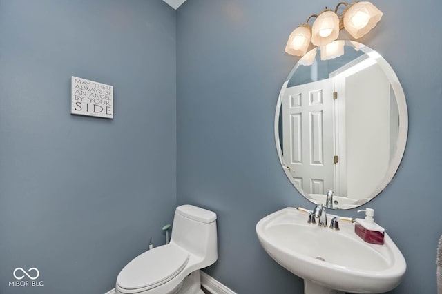 7844 N Timber Run Ct, Indianapolis, IN 46256 - half bathroom featuring a sink and toilet