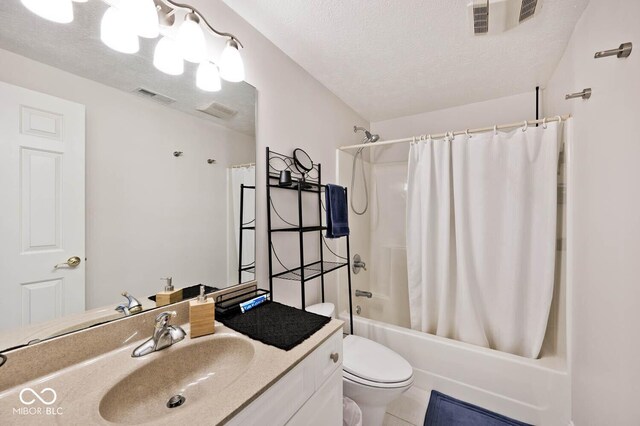 7844 N Timber Run Ct, Indianapolis, IN 46256 - bathroom with vanity, shower / tub combo, a textured ceiling, and tile patterned flooring
