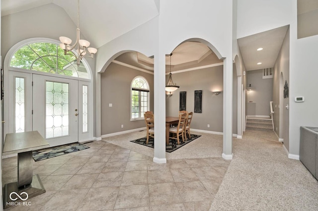 7844 N Timber Run Ct, Indianapolis, IN 46256 - entrance foyer with arched walkways, a chandelier, high vaulted ceiling, and recessed lighting